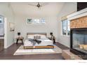 Spacious main bedroom with fireplace and large windows at 5065 3Rd St, Boulder, CO 80304