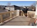 Spacious back deck featuring stained wood and white trim at 5065 S Haleyville St, Aurora, CO 80016