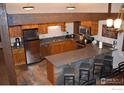 Modern kitchen with wood cabinets and granite countertops at 53 View Ln # A Week 40, Breckenridge, CO 80424