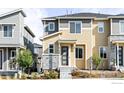 Two-story townhome with neutral siding and stone accents at 5335 Spalding Pl, Frederick, CO 80504