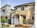 Two-story townhome with neutral siding and stone accents at 5335 Spalding Pl, Frederick, CO 80504