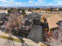 Expansive aerial view of a suburban neighborhood showcasing a well-maintained two-story home at 6433 Eagle Butte Ave, Frederick, CO 80516