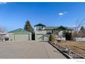 Charming single-Gathering home features a detached garage, a well-manicured lawn, and a classic white picket fence at 860 S Garrison St, Lakewood, CO 80226