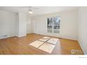 Living room with hardwood floors, lots of natural light, and ceiling fan at 965 W Willow St, Louisville, CO 80027