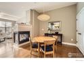 Dining area with modern lighting fixture and fireplace at 1379 Charles Dr # 4, Longmont, CO 80503