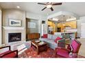 Inviting living room featuring a cozy fireplace, neutral color palette and seamlessly connected to the kitchen at 1379 Charles Dr # E6, Longmont, CO 80503