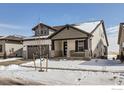 Attractive two-story home with a covered porch and snowy front yard at 2962 Newfound Lake Rd, Berthoud, CO 80513