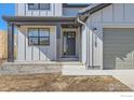 Charming two-story home with attached two-car garage and modern farmhouse-style architecture at 3109 Newfound Lake Rd, Berthoud, CO 80513
