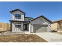 Charming two-story home with attached two-car garage and modern farmhouse-style architecture at 3109 Newfound Lake Rd, Berthoud, CO 80513