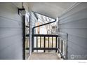 Cozy outdoor balcony space with natural light and a view of mature trees at 3275 34Th St # 77, Boulder, CO 80301