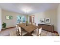 Bright dining room displaying hardwood floors and an elegant chandelier at 483 E State Highway 56, Berthoud, CO 80513