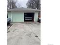Spacious garage featuring a truck parked inside and sliding door at 144 E 5Th Ave, Longmont, CO 80504