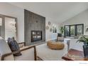 Bright living room features modern fireplace, neutral furniture and ample natural light at 2201 Juniper Ct, Boulder, CO 80304