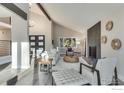Light-filled living room with vaulted ceiling, fireplace, and stylish decor at 2201 Juniper Ct, Boulder, CO 80304