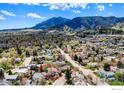 An aerial shot focuses on the property with mountain views and charming neighborhood surroundings at 508 Valley View Dr, Boulder, CO 80304