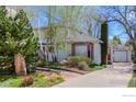 Two-story home with a well-manicured lawn, mature trees, and a detached garage at 508 Valley View Dr, Boulder, CO 80304