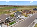 Aerial view of the home nestled in a community with beautiful landscaping at 1291 Swan Peter Dr, Berthoud, CO 80513