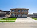 Charming home with a well-manicured lawn and a three-car garage, perfect for a growing Gathering at 1860 Chaffee Crest Dr, Berthoud, CO 80513
