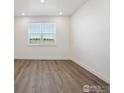 This bedroom is a blank canvas, ready for your personal touches with ample light and neutral wall colors at 1876 Chaffee Crest Dr, Berthoud, CO 80513