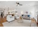 Bright living room with a ceiling fan, comfortable seating, and access to the kitchen at 3835 Norwood Ct, Boulder, CO 80304