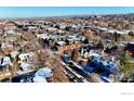 Expansive aerial shot of the property nestled in a vibrant city neighborhood with tree-lined streets and diverse architecture at 620 Pearl St # E, Boulder, CO 80302