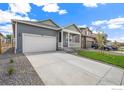 Attractive single-Gathering home with a spacious driveway and inviting front porch at 862 Crest St, Lochbuie, CO 80603