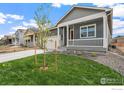 Beautiful home featuring a covered front porch and well-maintained landscaping at 862 Crest St, Lochbuie, CO 80603