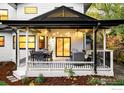Relaxing covered back porch features an outdoor dining and seating area with string lights at 1385 Kalmia Ave, Boulder, CO 80304