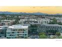 Expansive city and mountain view with surrounding neighborhood in the foreground at sunset at 1700 Bassett St # 1303, Denver, CO 80202