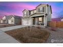 Lovely two-story home featuring neutral siding and a well-maintained front yard at 2509 Alto St, Fort Lupton, CO 80621