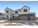 New construction two-story home with attached three-car garage in snowy neighborhood at 2748 Crystal Springs, Longmont, CO 80503