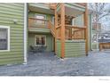 Exterior shot of building with back deck featuring an outdoor dining set at 3025 Broadway St # 18, Boulder, CO 80304