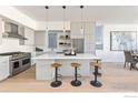 Bright, modern kitchen featuring a large island with seating and stainless steel appliances at 3315 Broadway St, Boulder, CO 80304