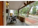 Cozy front porch with chairs, providing a comfortable spot to enjoy the neighborhood view at 3440 W 33Rd Ave, Denver, CO 80211