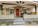 Inviting front porch with seating area and brick accents, offering a relaxing outdoor space at 3440 W 33Rd Ave, Denver, CO 80211