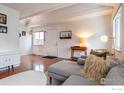 Cozy living room featuring hardwood floors, a comfortable gray sectional sofa, and bright natural light at 3630 Iris Ave # D, Boulder, CO 80301