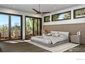 Bedroom featuring an outdoor balcony, wood floors, and scenic views at 2595 Glenwood Dr, Boulder, CO 80304