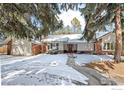 Beautiful single-story home with attached garage and snow-covered front yard and driveway at 4862 Silver Sage Ct, Boulder, CO 80301