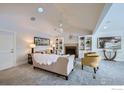 Bright and airy living room with vaulted ceilings, fireplace, and built-in shelving at 4869 Kellogg Cir, Boulder, CO 80303