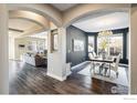 Open-concept dining room featuring stylish chandelier and dark accent wall at 722 Hutchinson St, Louisville, CO 80027