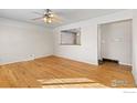 A brightly lit living room features hardwood flooring and a view into another room at 805 38Th St, Boulder, CO 80303