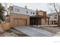 Modern two-story home featuring a wood facade, concrete driveway and attached garage at 864 Iris Ave, Boulder, CO 80304