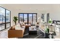 Bright living room with a cozy seating arrangement, large windows, and natural light at 864 Iris Ave, Boulder, CO 80304