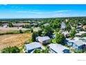 An aerial view of the residential neighborhood showcasing the layout and surrounding green spaces at 1057 W 112Th Ave # D, Denver, CO 80234