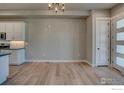 Dining area featuring modern lighting and convenient access to kitchen, offering ample space at 202 High Point Dr, Longmont, CO 80504