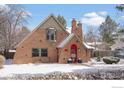 Beautiful brick home with a red door and snow-covered yard, located in a lovely neighborhood at 3584 Kirkwood Pl, Boulder, CO 80304