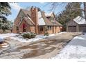 Attractive brick house with driveway and detached garage, showcasing classic design and snowy landscape at 3584 Kirkwood Pl, Boulder, CO 80304