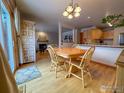 Bright dining area with hardwood floors, wooden table and chairs, and sliding glass doors at 4491 Wellington Rd, Boulder, CO 80301