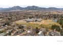 Scenic aerial view highlighting a school surrounded by homes and mountain views at 5003 Forsythe Pl, Boulder, CO 80303