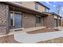 Inviting front entrance with brick accents and walkway leading to the door at 5003 Forsythe Pl, Boulder, CO 80303